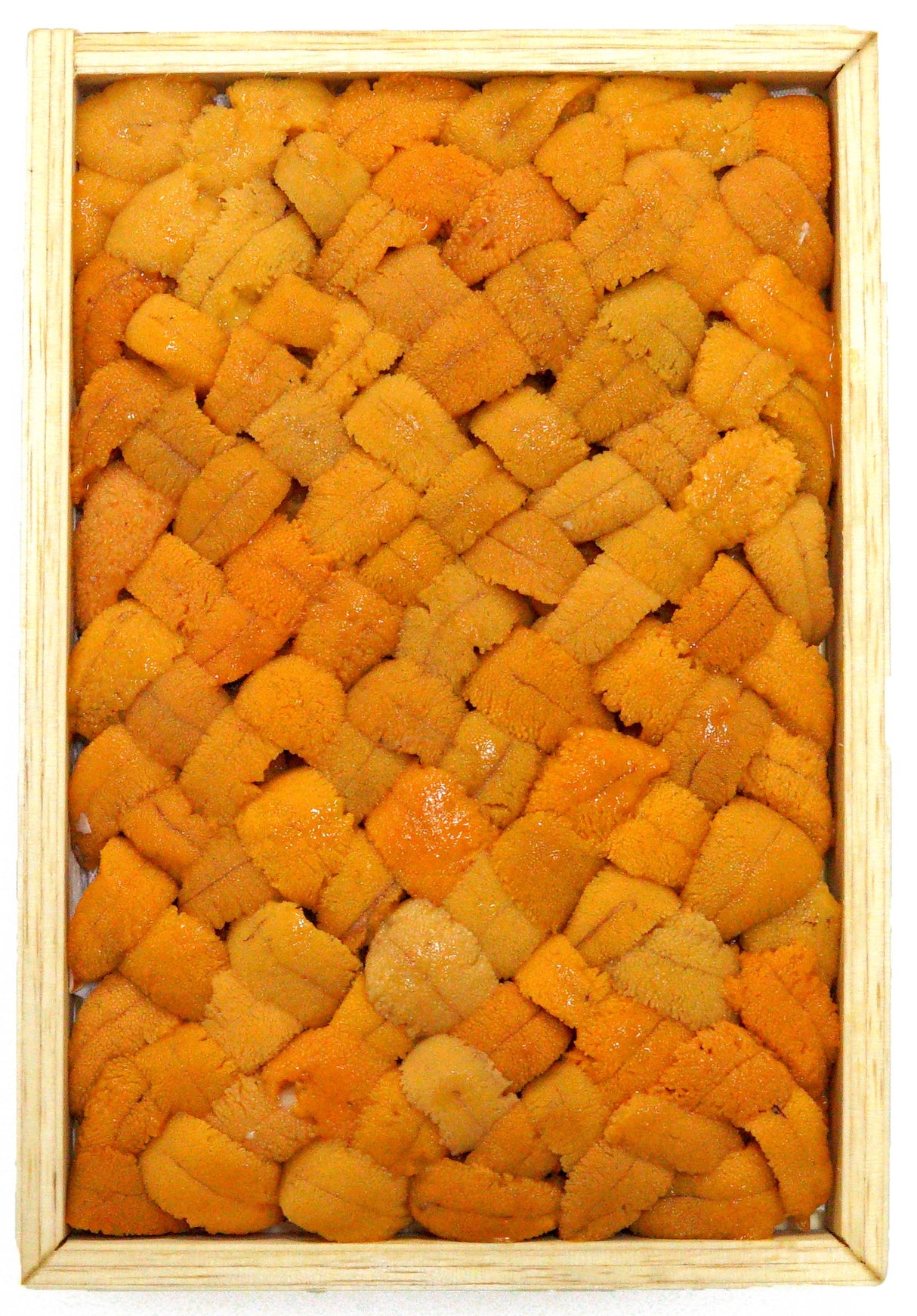 Yellow Bara Bafun uni consists of high quality Yellow uni that have been meticulously place together in Hokkaido to form the "Bara" or crossed pattern. The cross pattern is normally used when the Uni are of different shape and size.  Rest assured that the uni you receive will be of top quality.   Freshly caught Yellow Bafun Uni (Sea Urchin) has a bright beautiful yellow colour with firm texture and tastes like chestnuts.