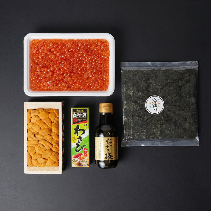 Assorted sushi ingredients including caviar, pickled ginger, and seaweed on a black background